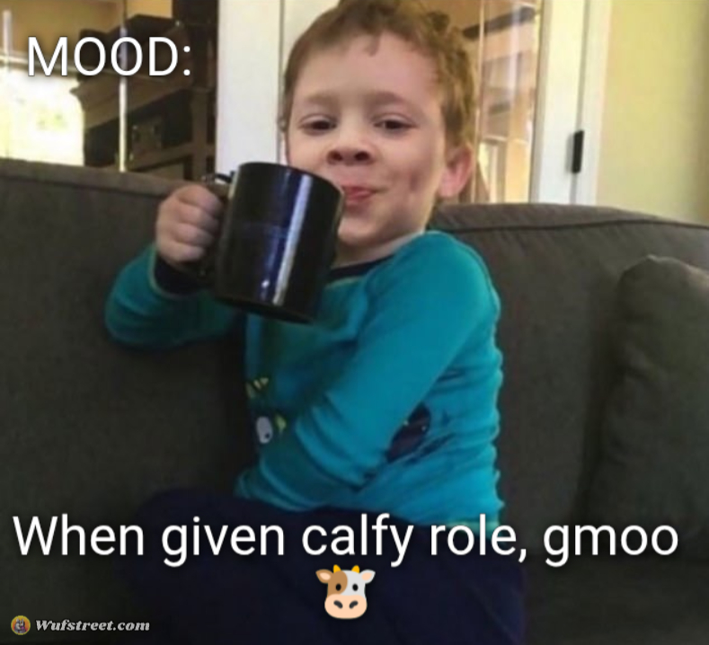 Smug kid with coffee cup on couch